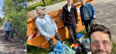 Müllsammelcrew vor dem Container